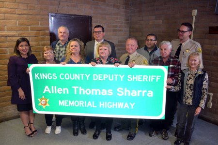 Gina Sharra with friends, family, legislators and Kings County officials as her late husband, Deputy Allen Sharra is honored with a Memorial Highway designation.